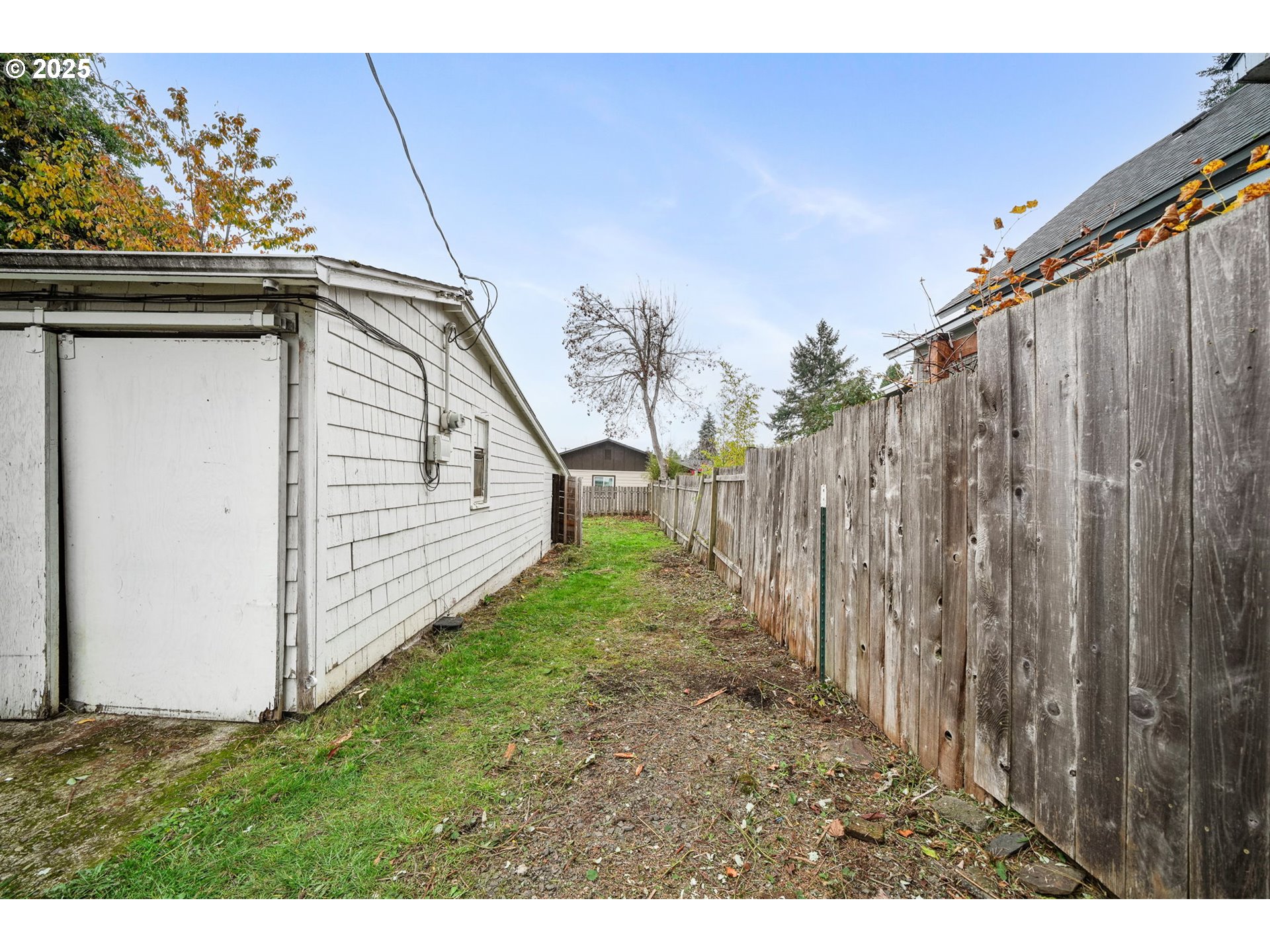 810 Johnson Avenue Cottage Grove, OR 97424 - Photo 16 of 17 a view of a backyard with wooden fence