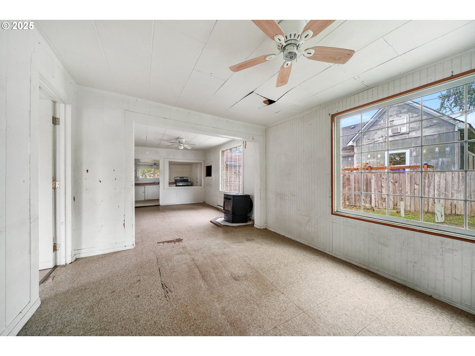 810 Johnson Avenue Cottage Grove, OR 97424 - Photo 3 of 17 a view of an empty room with a window