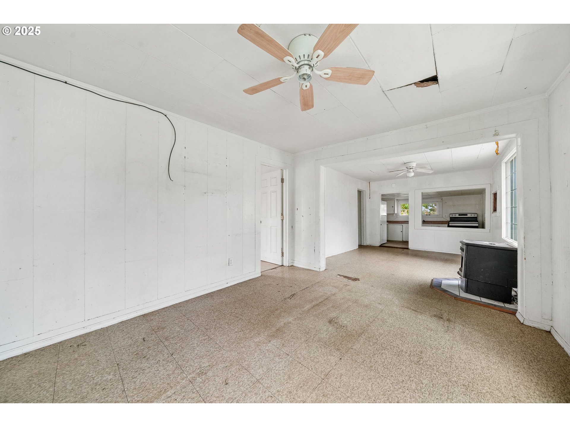 810 Johnson Avenue Cottage Grove, OR 97424 - Photo 5 of 17 a view of a kitchen with a sink and a refrigerator