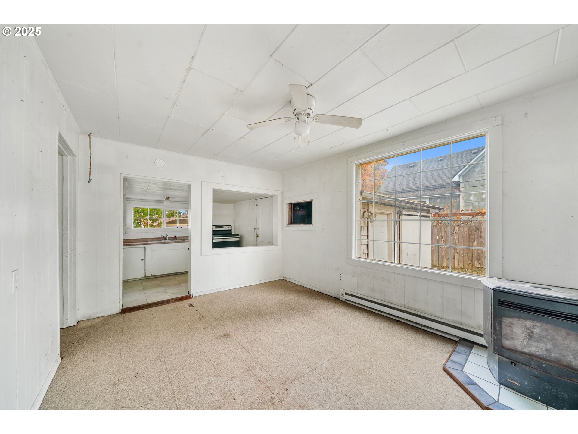 810 Johnson Avenue Cottage Grove, OR 97424 - Photo 6 of 17 a view of an empty room with a window