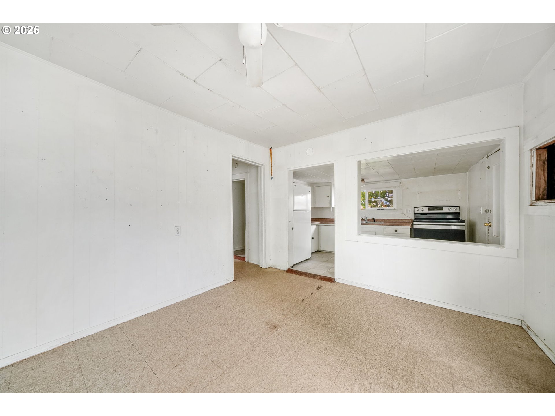 810 Johnson Avenue Cottage Grove, OR 97424 - Photo 7 of 17 a view of empty room with kitchen and window