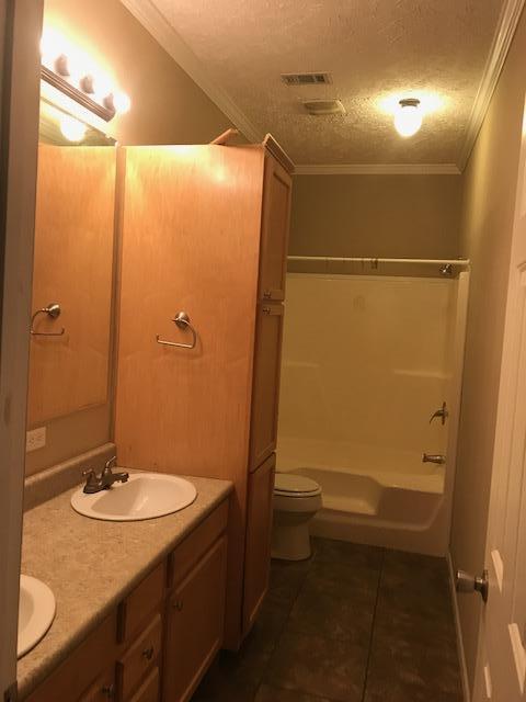 4036 Poverty Creek Road Crestview, FL 32539 - Photo 11 of 24 a bathroom with a sink toilet and shower