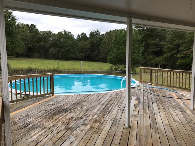 4036 Poverty Creek Road Crestview, FL 32539 - Photo 13 of 24 a view of a balcony with yard