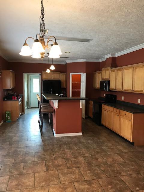 4036 Poverty Creek Road Crestview, FL 32539 - Photo 23 of 24 a view of a livingroom with furniture and a kitchen