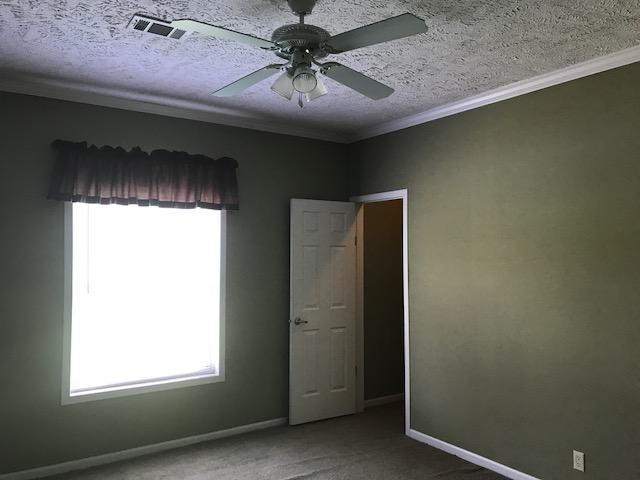 4036 Poverty Creek Road Crestview, FL 32539 - Photo 6 of 24 a chandelier fan in a room