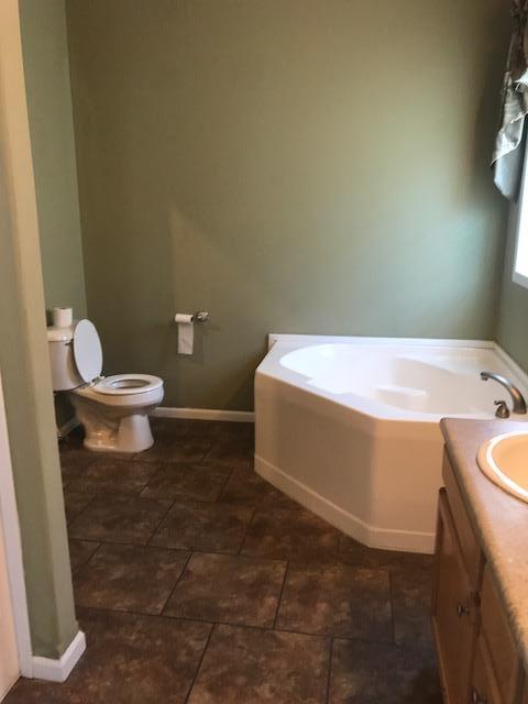 4036 Poverty Creek Road Crestview, FL 32539 - Photo 7 of 24 a bathroom with a sink a toilet and a bathtub