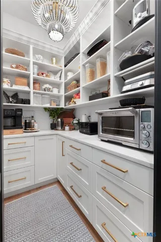 a kitchen with a oven and cabinets