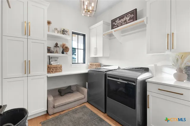 a utility room with washer and dryer
