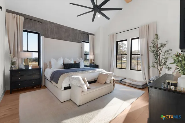 a bedroom with a bed and window