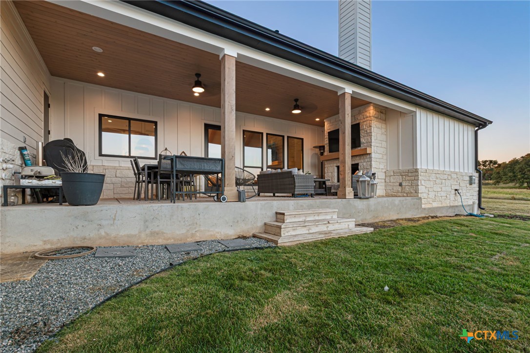871 Blackbuck Ridge Drive Lampasas, TX 76550 - Photo 40 of 48 a view of a patio with dining table and chairs with plants