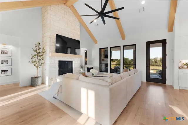 a living room with fireplace furniture and a flat screen tv
