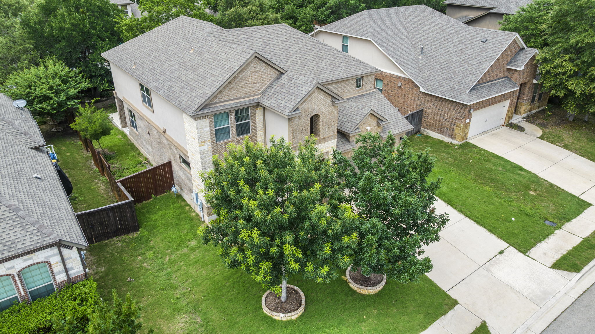 4401 Trinity Woods Street Leander, TX 78641 - Photo 35 of 37 An aerial perspective reveals a handsome suburban home with a manicured front yard and an attached garage.