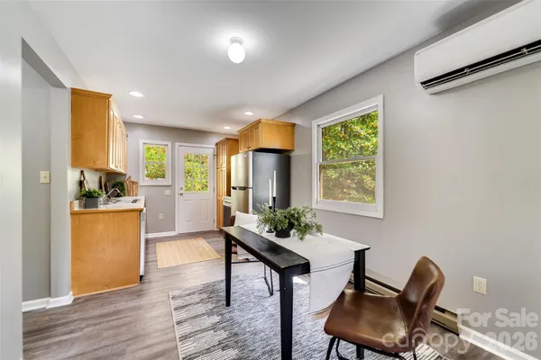 a view of a dining room with furniture window and outside view