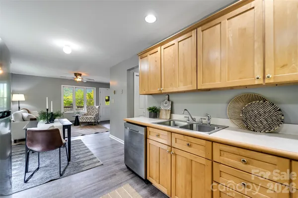 a kitchen with sink cabinets and window