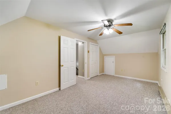 a view of a chandelier fan in a room