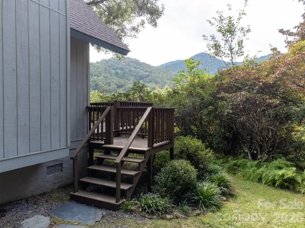 a view of a two chairs in the balcony