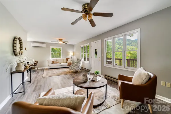 a living room with furniture and a large window