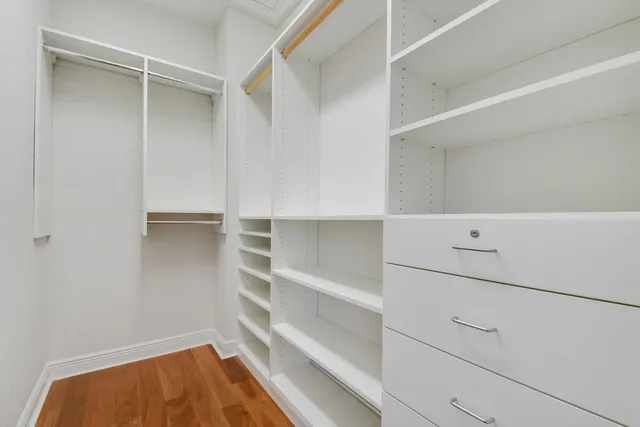 a view of an empty walk in closet