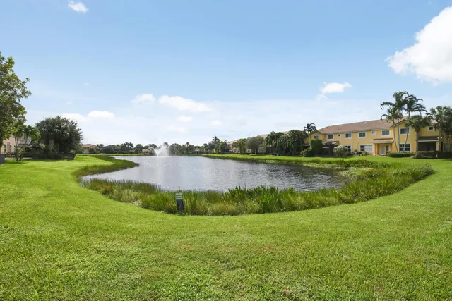 a view of a lake with houses in the back