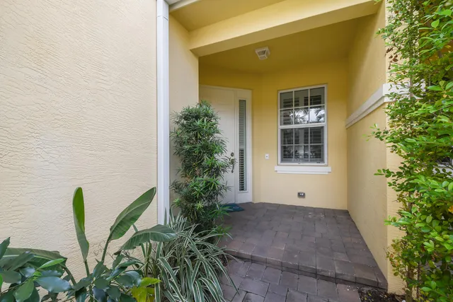 a view of an entryway of a house and livingroom with furniture