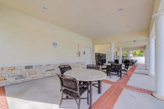 a view of a dining room with furniture and window