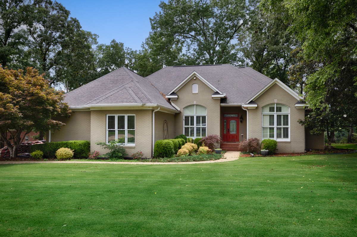 332 Riverfront Road Rogersville, AL 35652 - Photo 1 of 52 a front view of a house with garden and porch