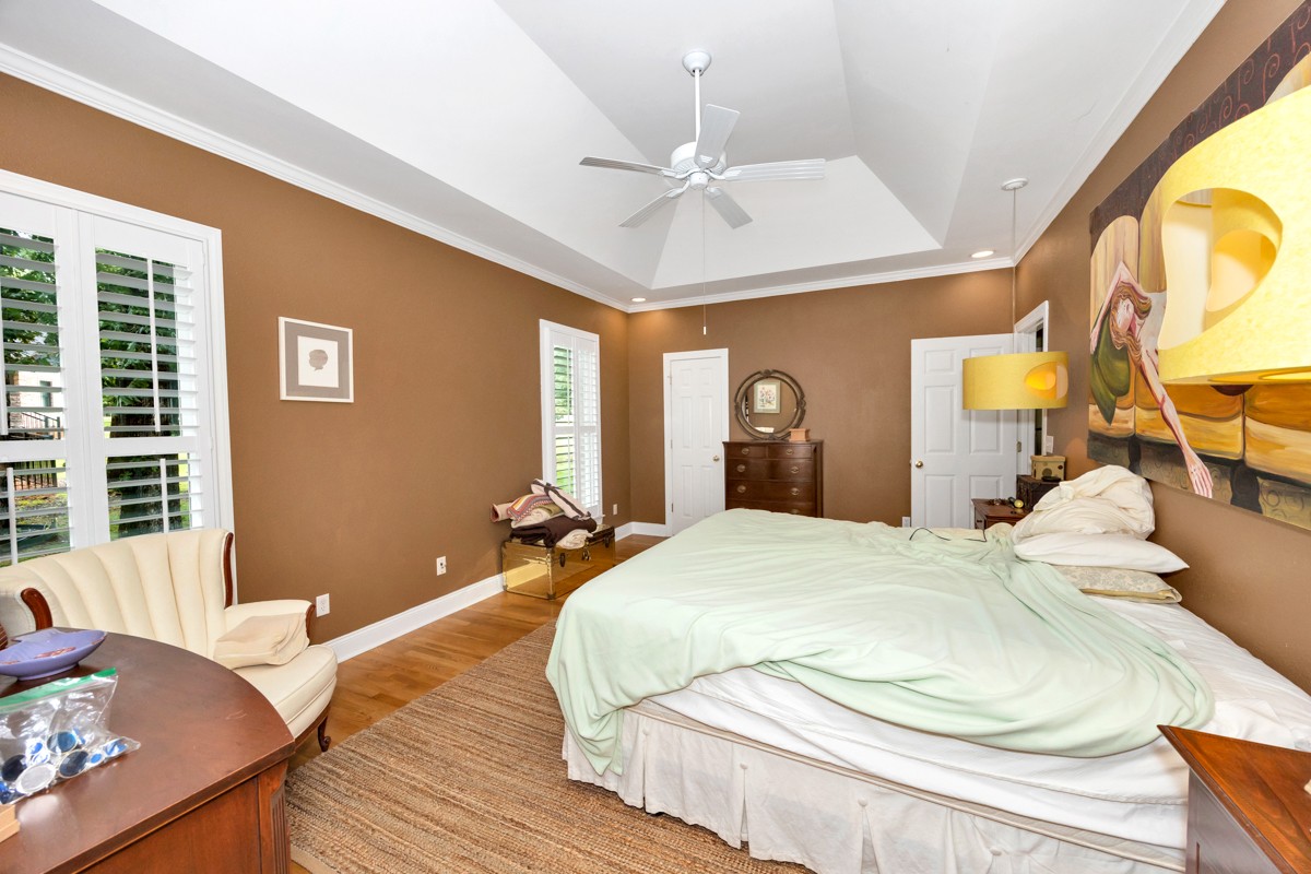 332 Riverfront Road Rogersville, AL 35652 - Photo 18 of 52 a bedroom with a bed and dresser with mirror