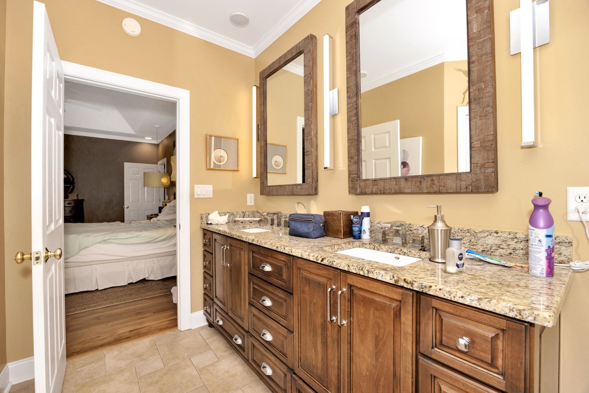 332 Riverfront Road Rogersville, AL 35652 - Photo 20 of 52 a bathroom with a granite countertop sink and a mirror