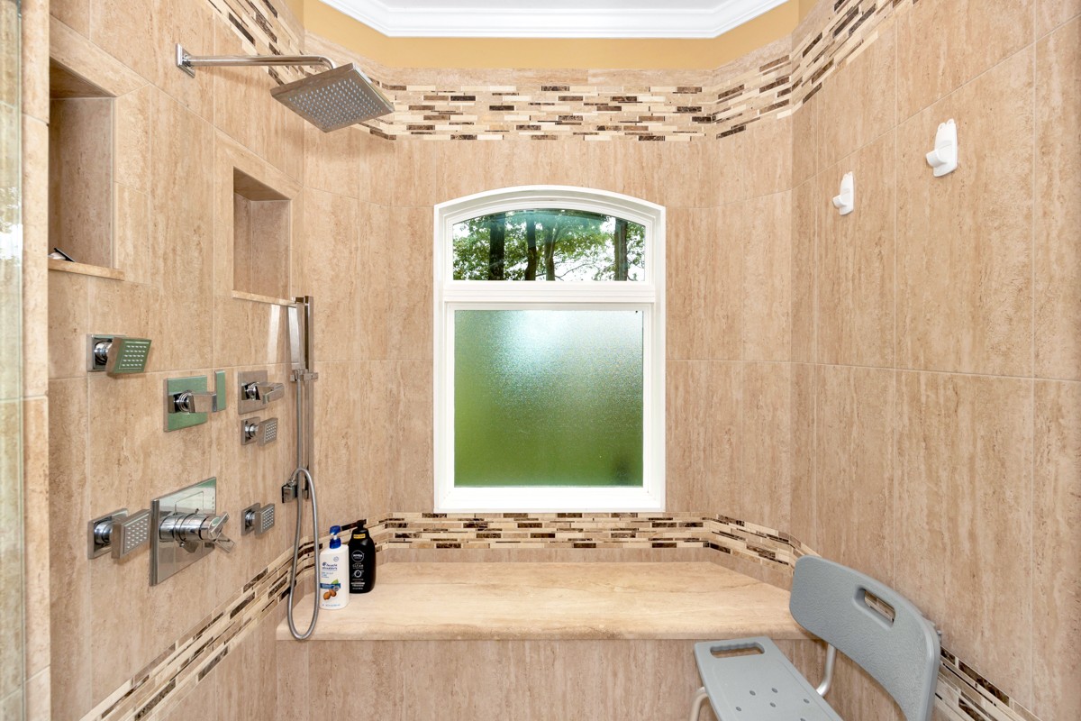 332 Riverfront Road Rogersville, AL 35652 - Photo 22 of 52 a bathroom with a sink and a mirror