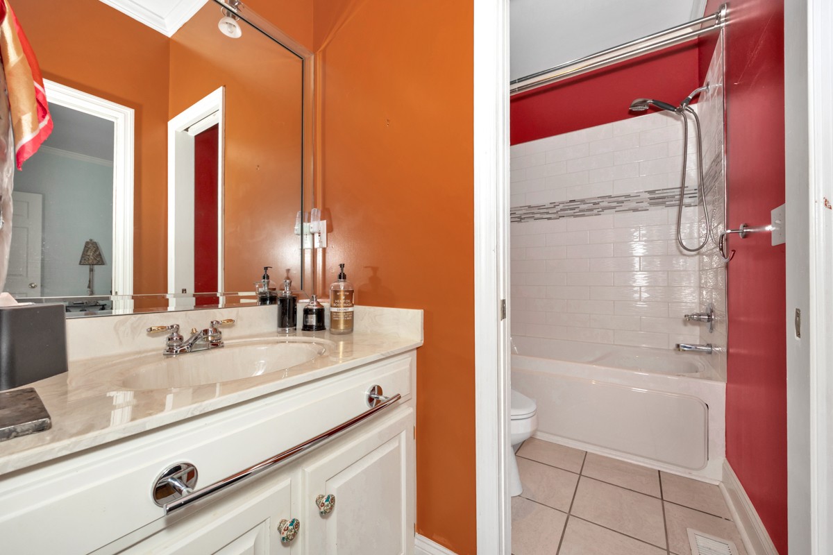 332 Riverfront Road Rogersville, AL 35652 - Photo 25 of 52 a bathroom with a granite countertop sink and a mirror