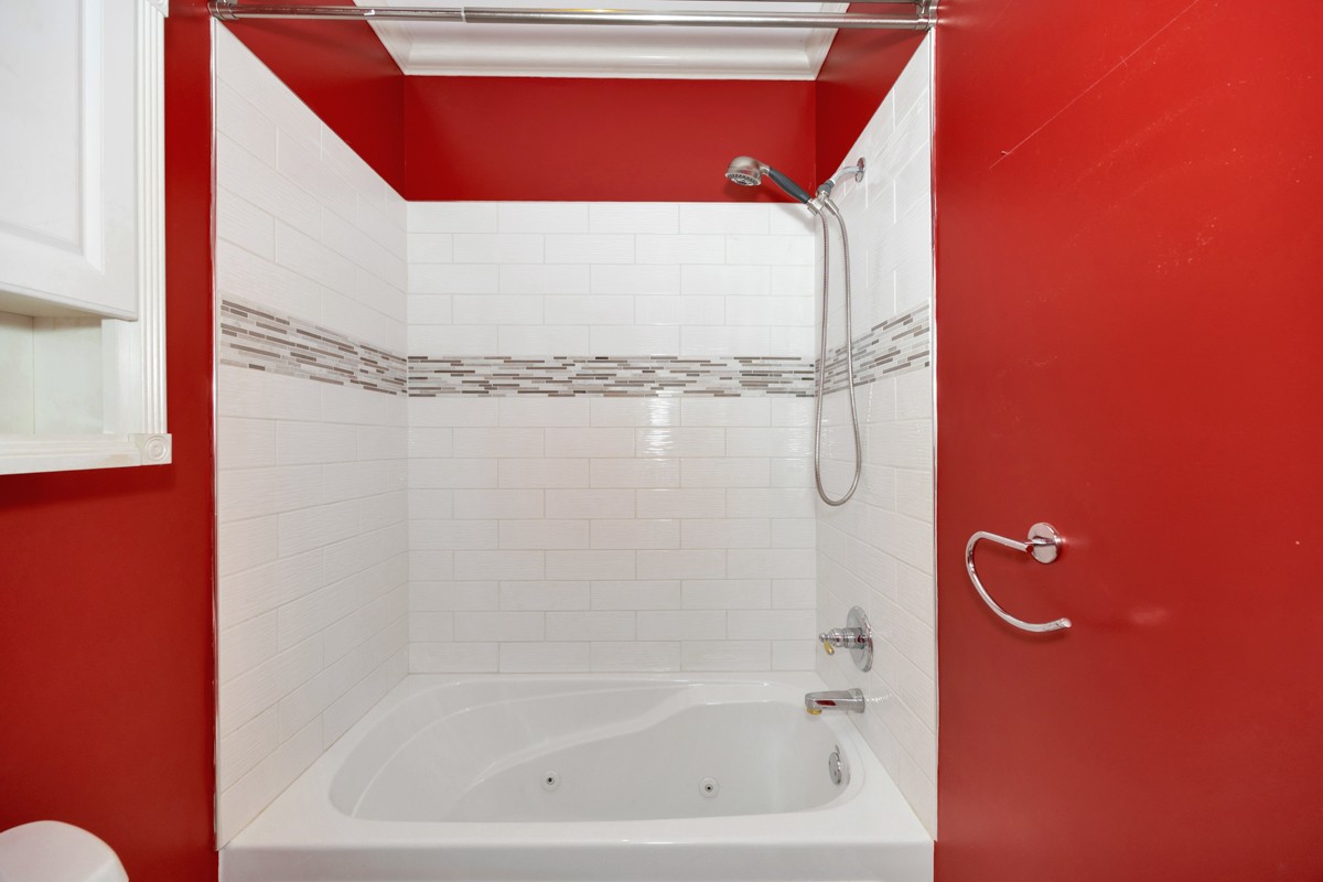 332 Riverfront Road Rogersville, AL 35652 - Photo 26 of 52 a bathroom with a bathtub and shower
