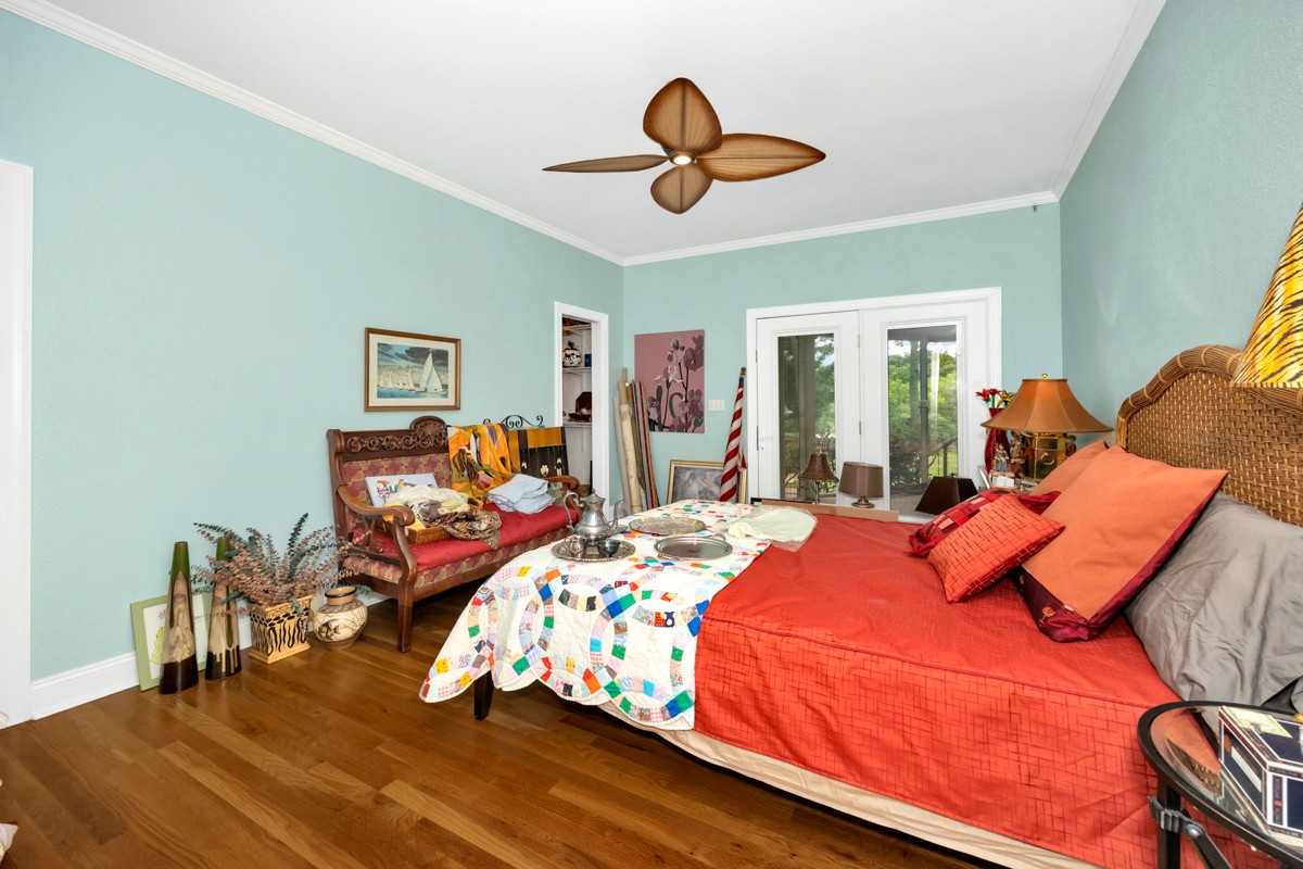 332 Riverfront Road Rogersville, AL 35652 - Photo 28 of 52 a bed room with a bed and a chandelier