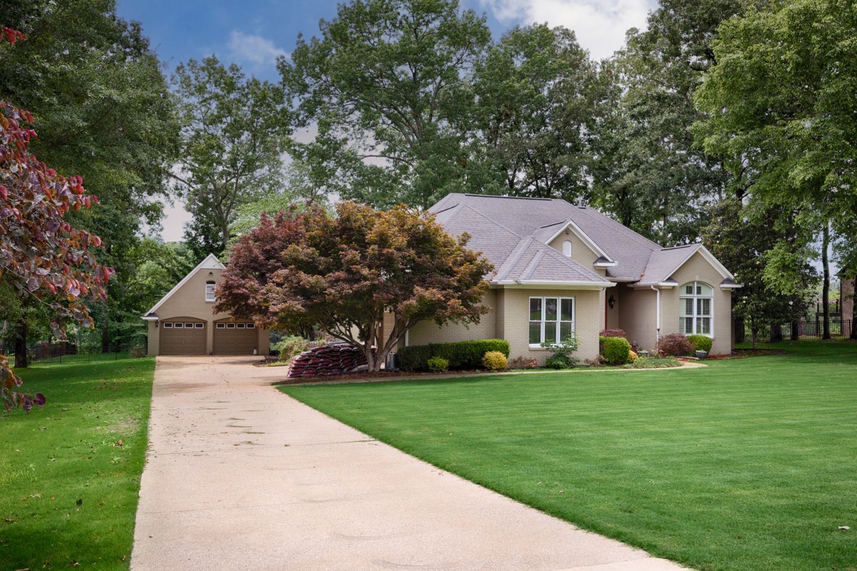 332 Riverfront Road Rogersville, AL 35652 - Photo 30 of 52 a front view of a house with a yard and trees