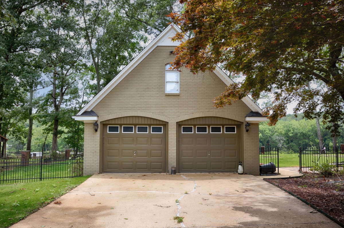 332 Riverfront Road Rogersville, AL 35652 - Photo 34 of 52 a front view of a house with a yard and garage