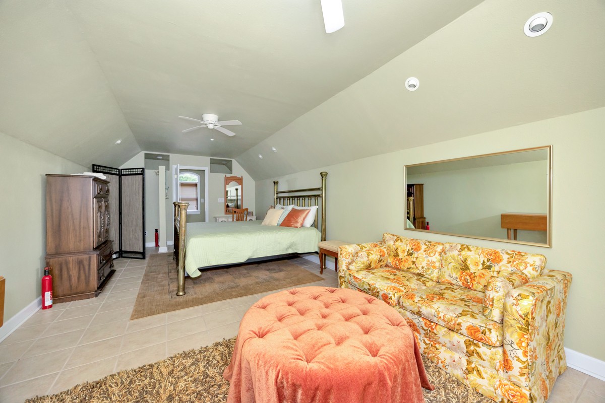 332 Riverfront Road Rogersville, AL 35652 - Photo 35 of 52 a bedroom with a bed and wooden floor