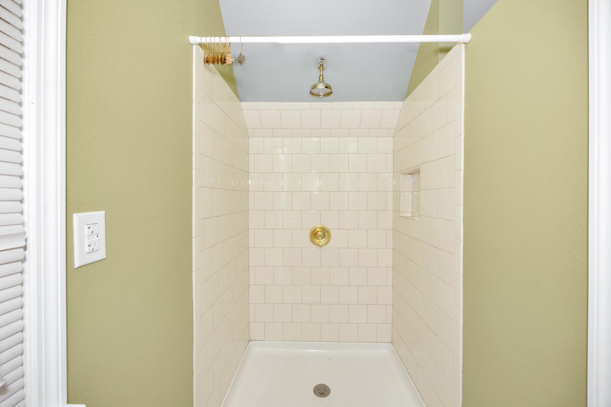 332 Riverfront Road Rogersville, AL 35652 - Photo 38 of 52 a bathroom with a shower and a sink