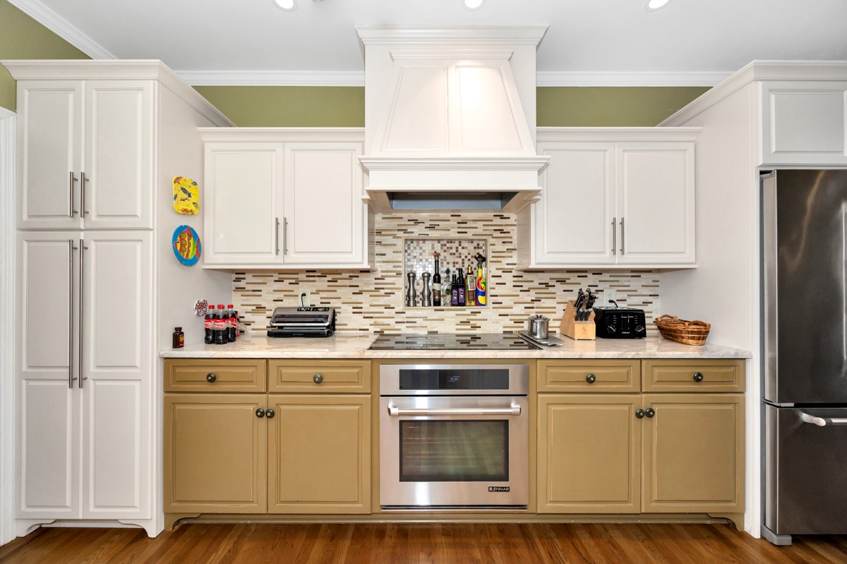 332 Riverfront Road Rogersville, AL 35652 - Photo 6 of 52 a kitchen with white cabinets and white appliances