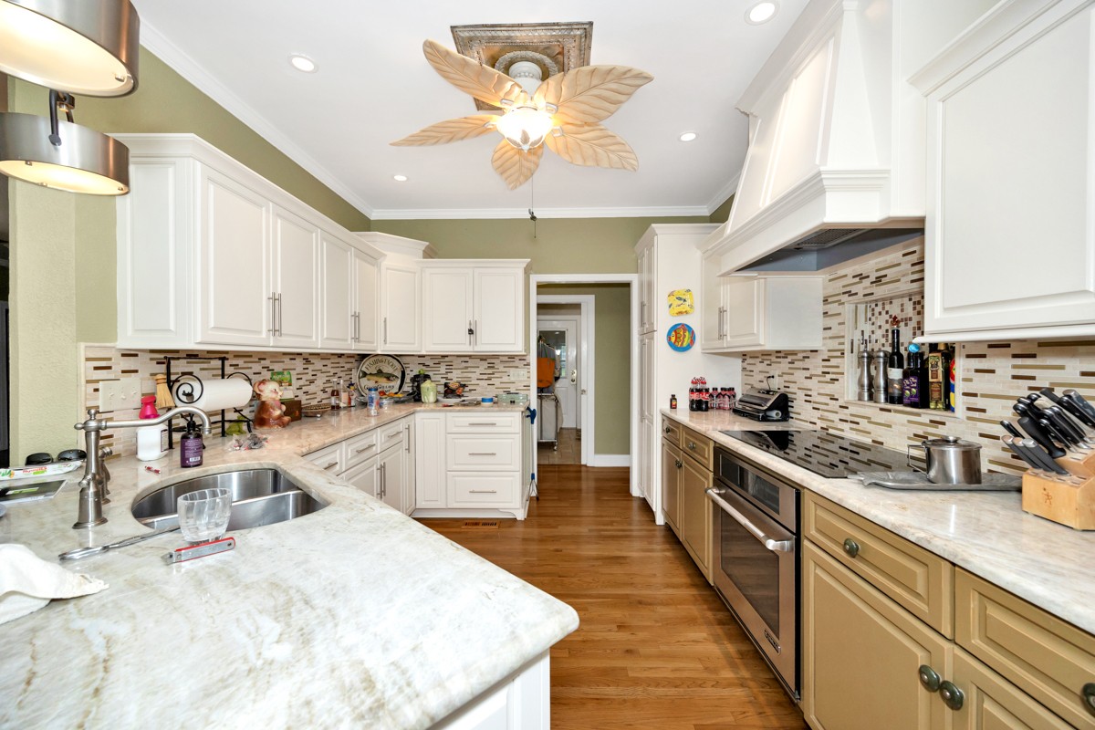 332 Riverfront Road Rogersville, AL 35652 - Photo 8 of 52 a kitchen with stainless steel appliances kitchen island granite countertop a sink stove and cabinets