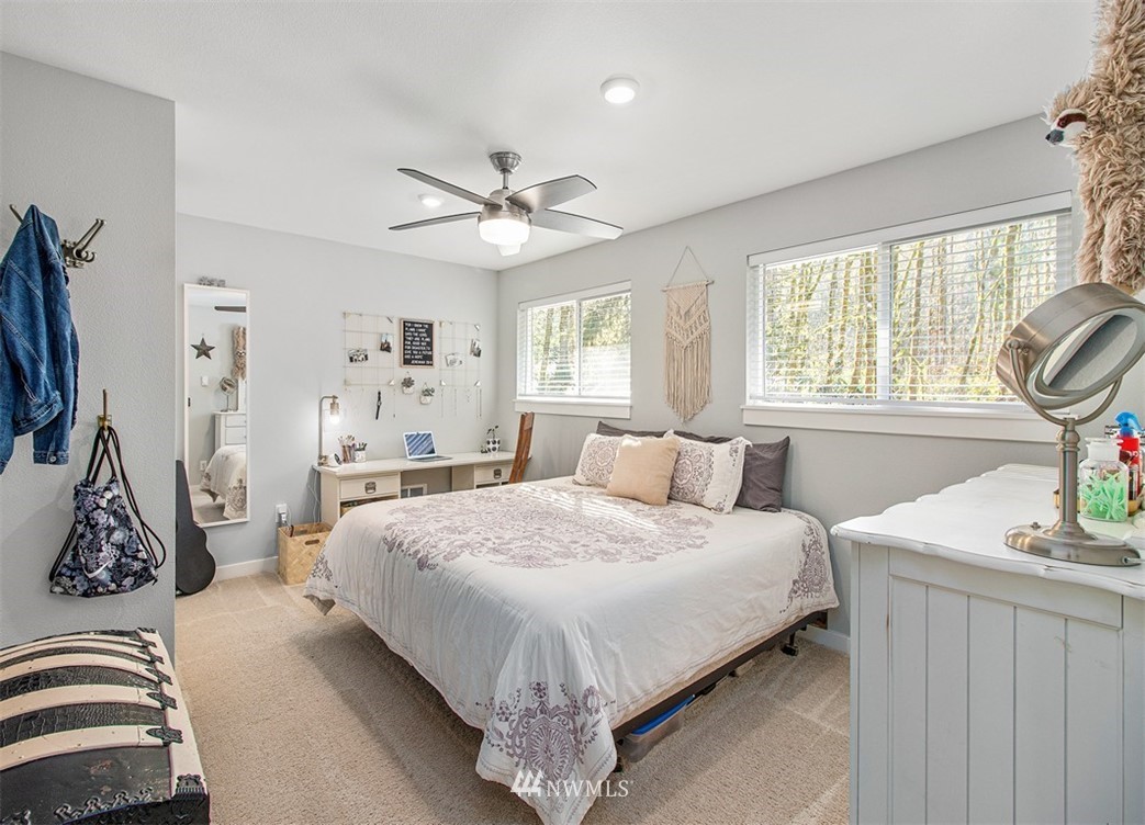 46020 Southeast Edgewick Road North Bend, WA 98045 - Photo 12 of 24 a bedroom with a bed flat screen tv and a window