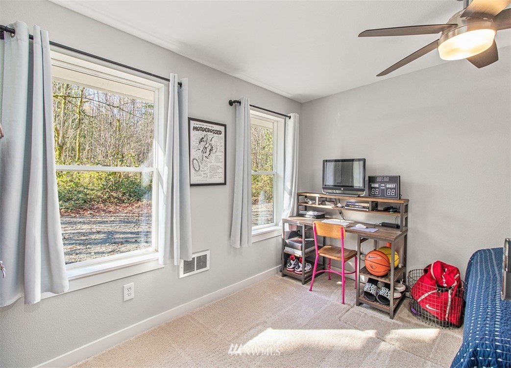 46020 Southeast Edgewick Road North Bend, WA 98045 - Photo 13 of 24 a view of a livingroom with workspace and a window