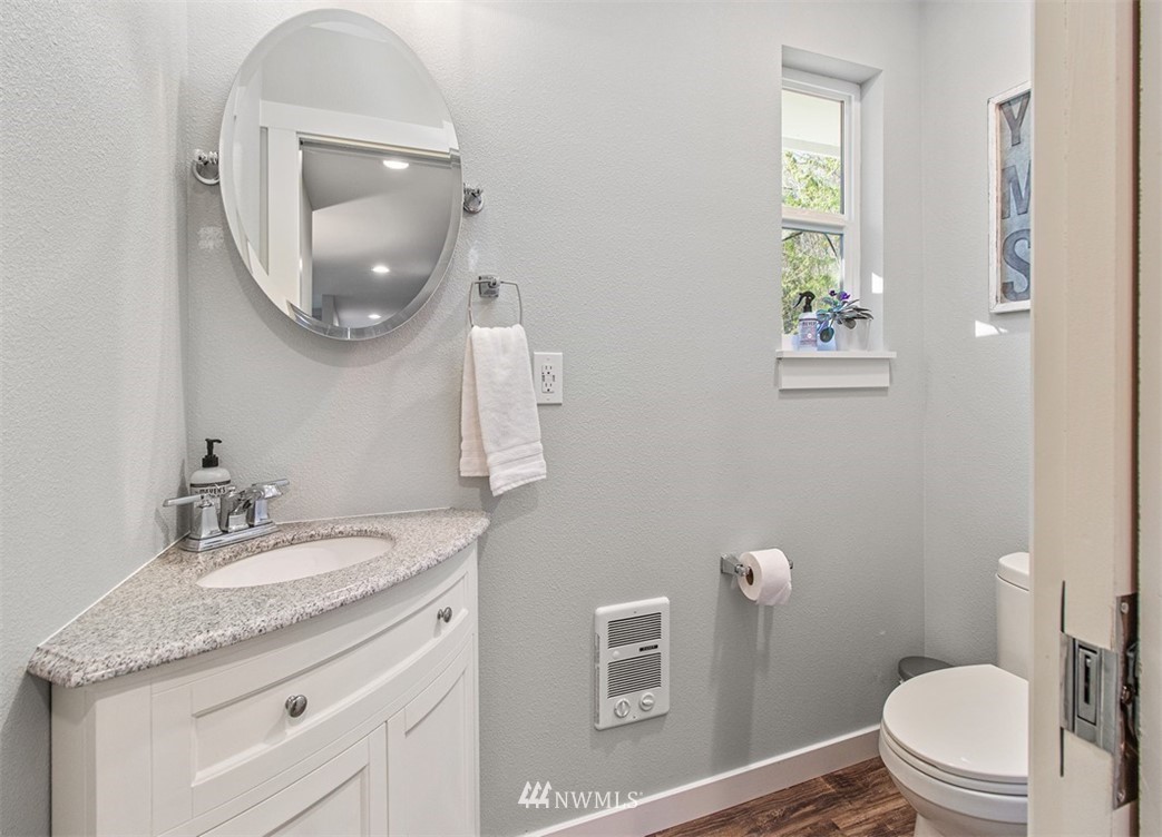46020 Southeast Edgewick Road North Bend, WA 98045 - Photo 14 of 24 a bathroom with a granite countertop toilet sink and mirror