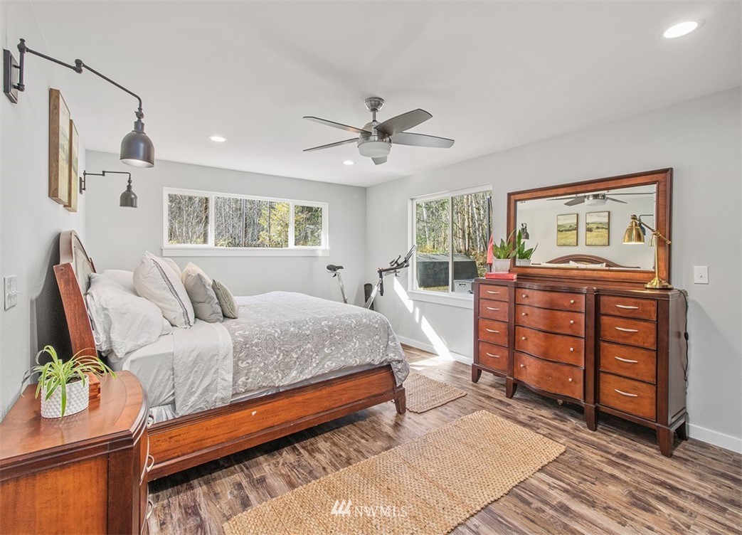 46020 Southeast Edgewick Road North Bend, WA 98045 - Photo 15 of 24 a spacious bedroom with a bed and wooden floor