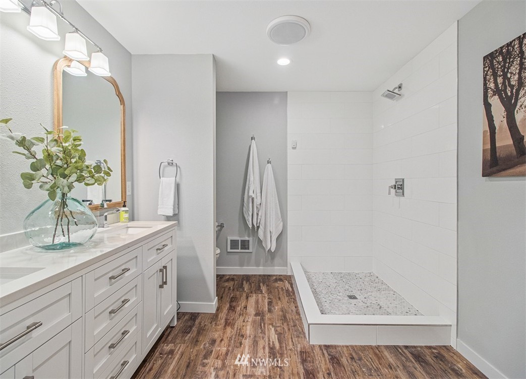 46020 Southeast Edgewick Road North Bend, WA 98045 - Photo 16 of 24 a bathroom with a double vanity sink and a mirror