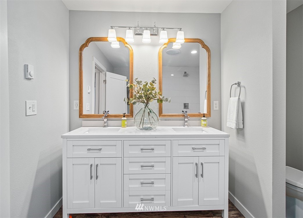 46020 Southeast Edgewick Road North Bend, WA 98045 - Photo 17 of 24 a bathroom with a double vanity sink and a mirror