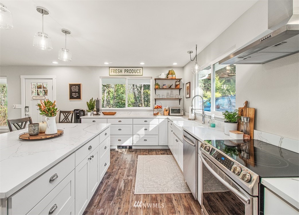 46020 Southeast Edgewick Road North Bend, WA 98045 - Photo 4 of 24 a kitchen with stainless steel appliances sink stove and cabinets