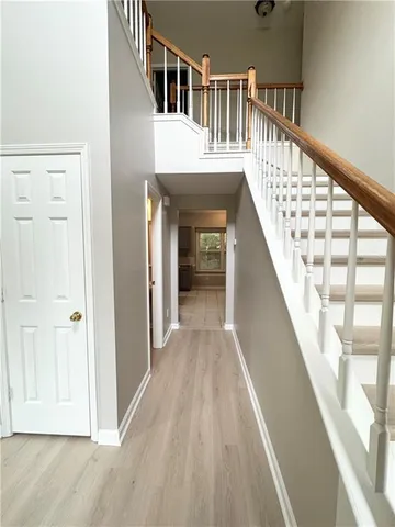 a view of entryway with wooden floor and stairs