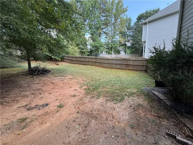 a view of backyard with green space