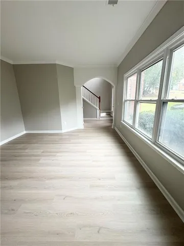 a view of an empty room with a window