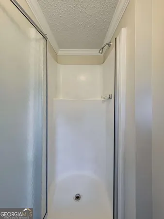 an empty room with wooden floor and window