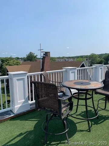 a view of a terrace with furniture